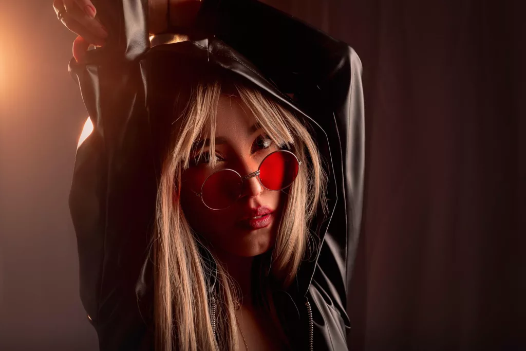 OliviaMonroe has a black hoodie with red tented glasses looking for trouble