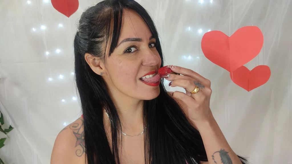 lailacastillo is licking a strawberry