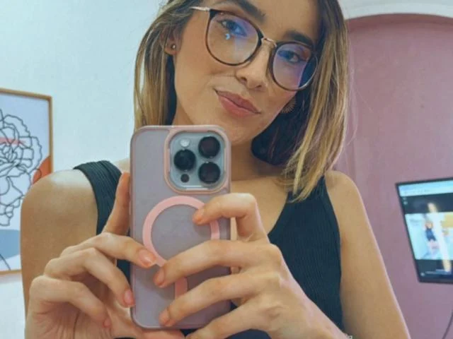 adharacooper is taking a self with her glasses on