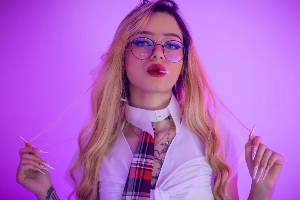 MiaValentine suck on a lollipop pulling her bleached hair