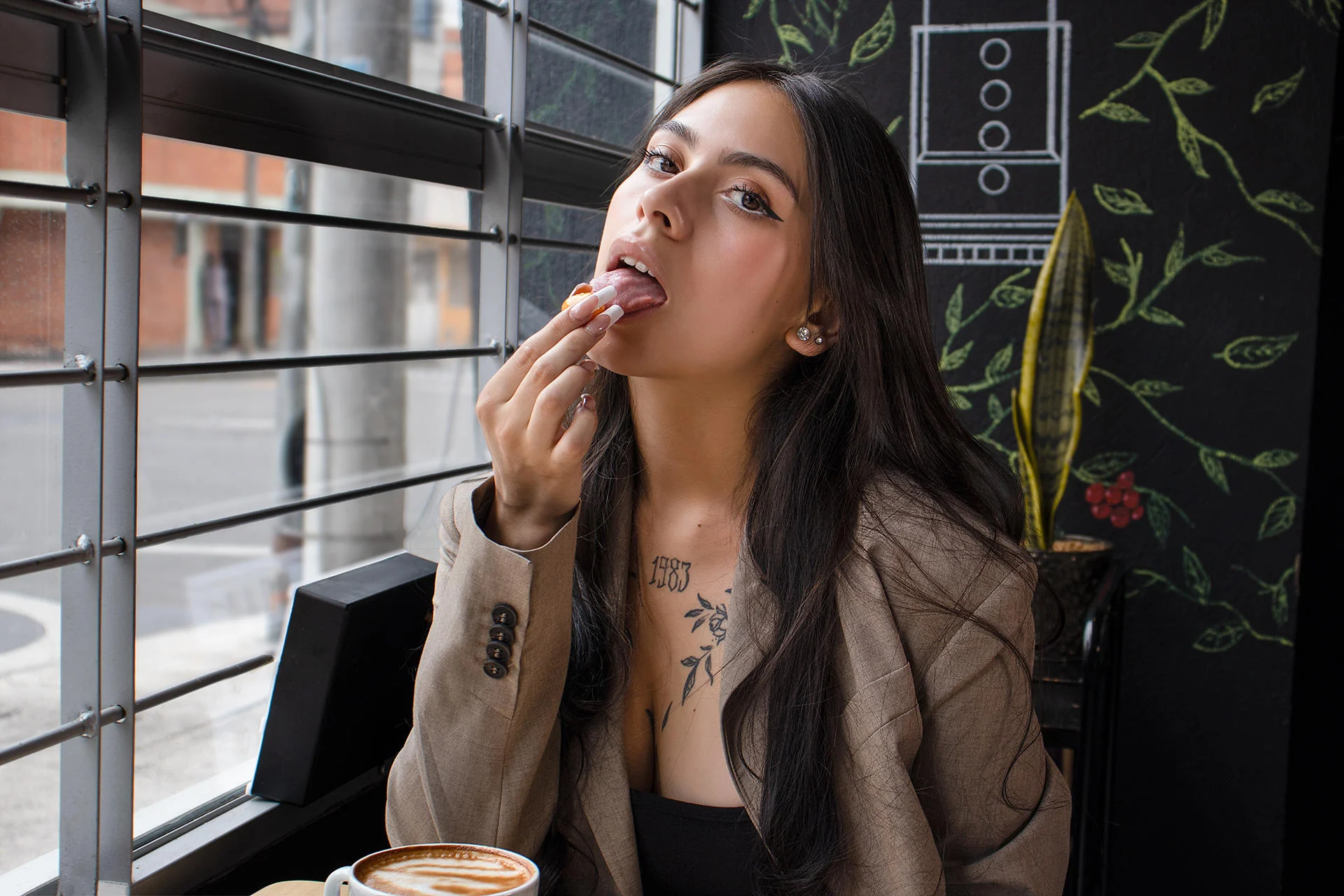 chanelderosee eating a breakfast treat seductively in a short skirt attire