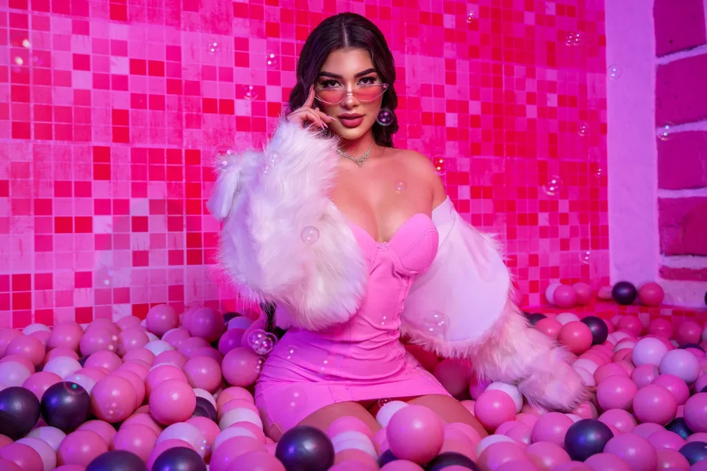 SofiiaMartinez is all pink in a pink room surround by pink balls looking fire