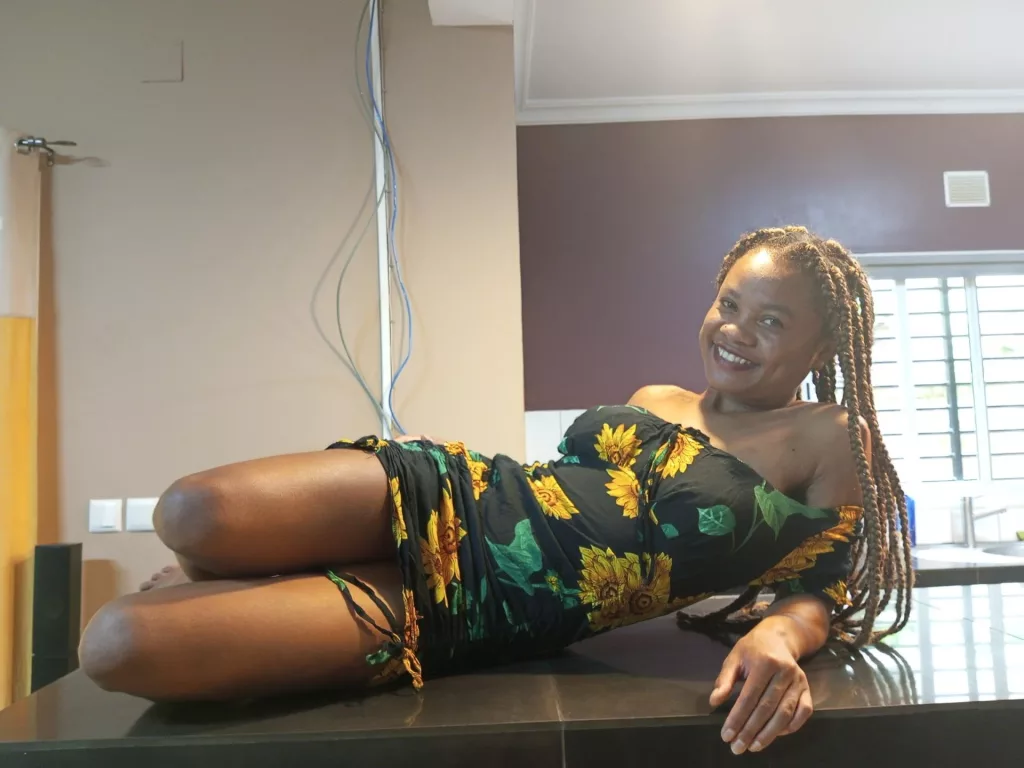 TropicalFunPaloma lays on kitchen counter top in a joyful way