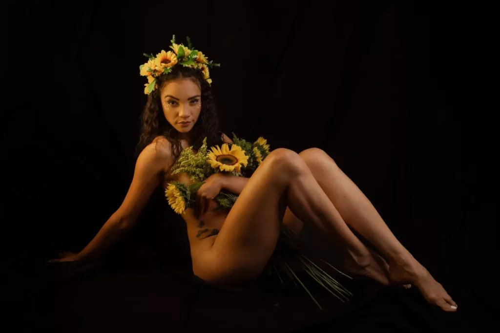 AndromedaZareth is hiding her body behind flowers, show off her long legs