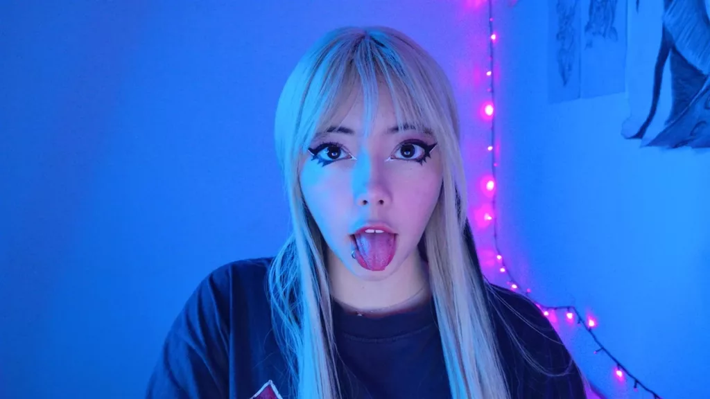 Arieyaara stick her tongue out in a new neon back light room