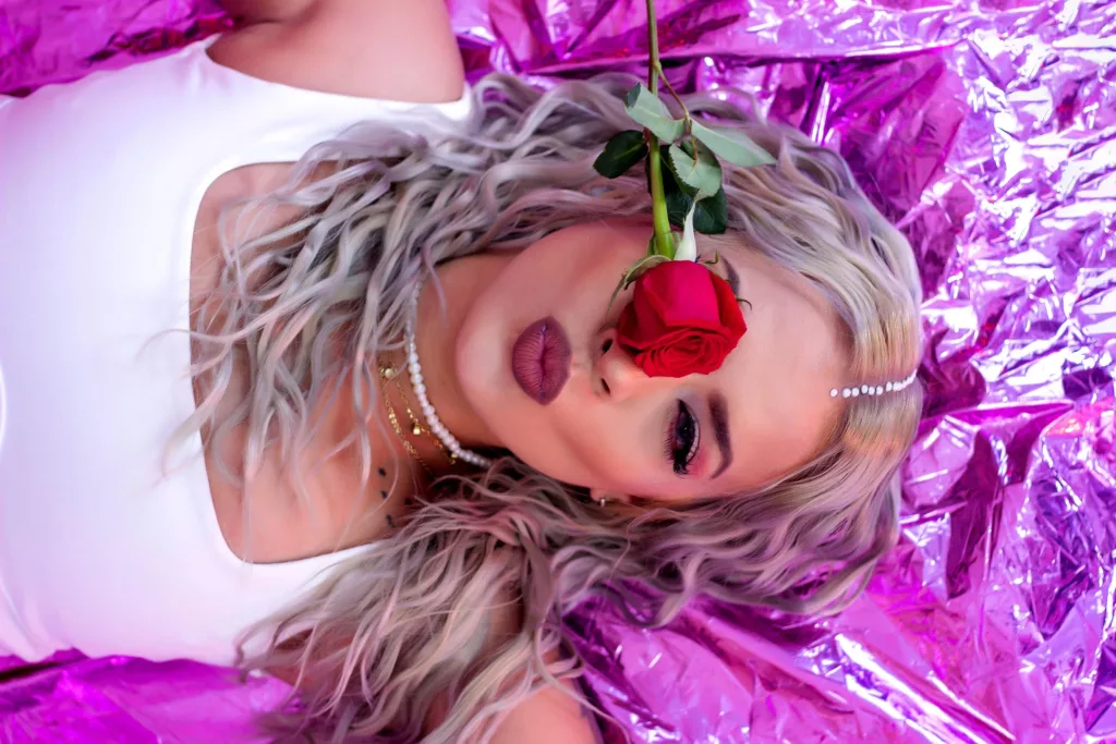 ChantalSex69 takes an amazing picture on her back with a rose over her eye