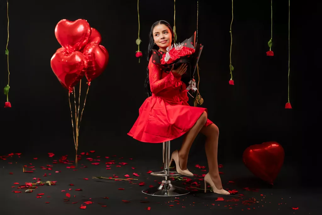 Greicystar is dress in a red ball dress.