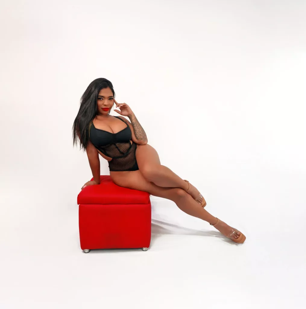 Discover the seductive world of ebony BBW with VickyGreys. Dressed in a black once piece long legs and heels on