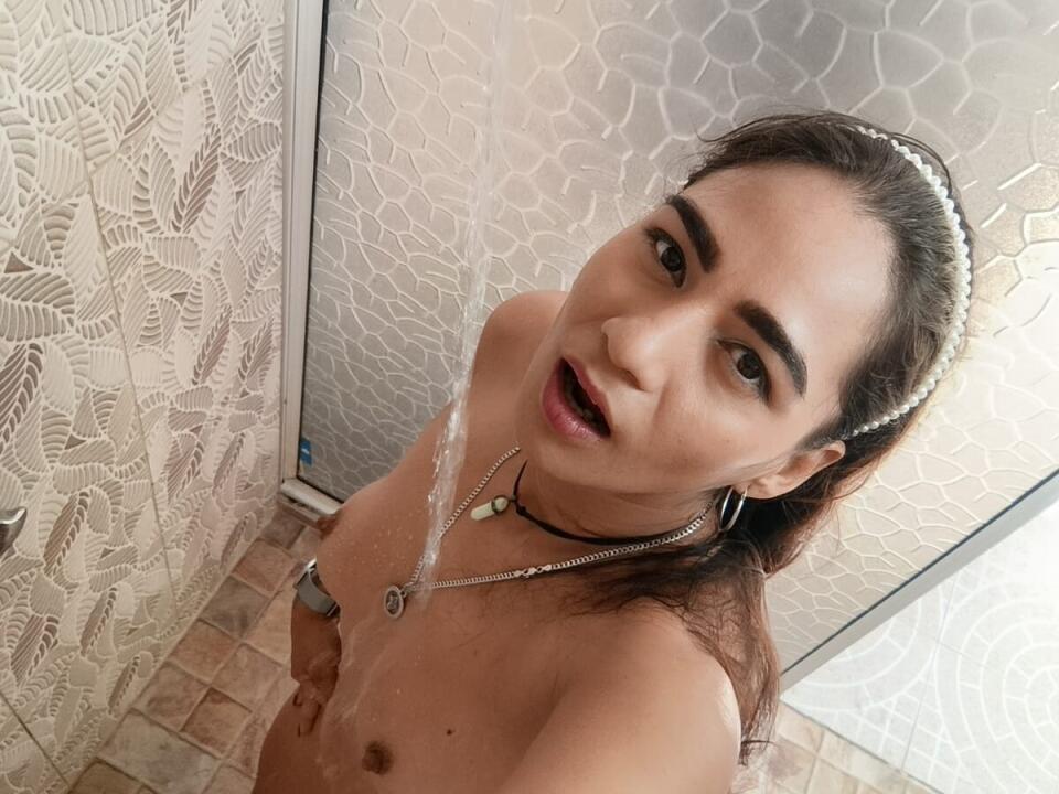 Wet & Wild – Nude in the shower, water dripping down her athletic, glistening body