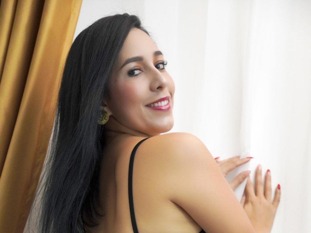 Katty’s average tits spill from her bra, blush on her cheeks.