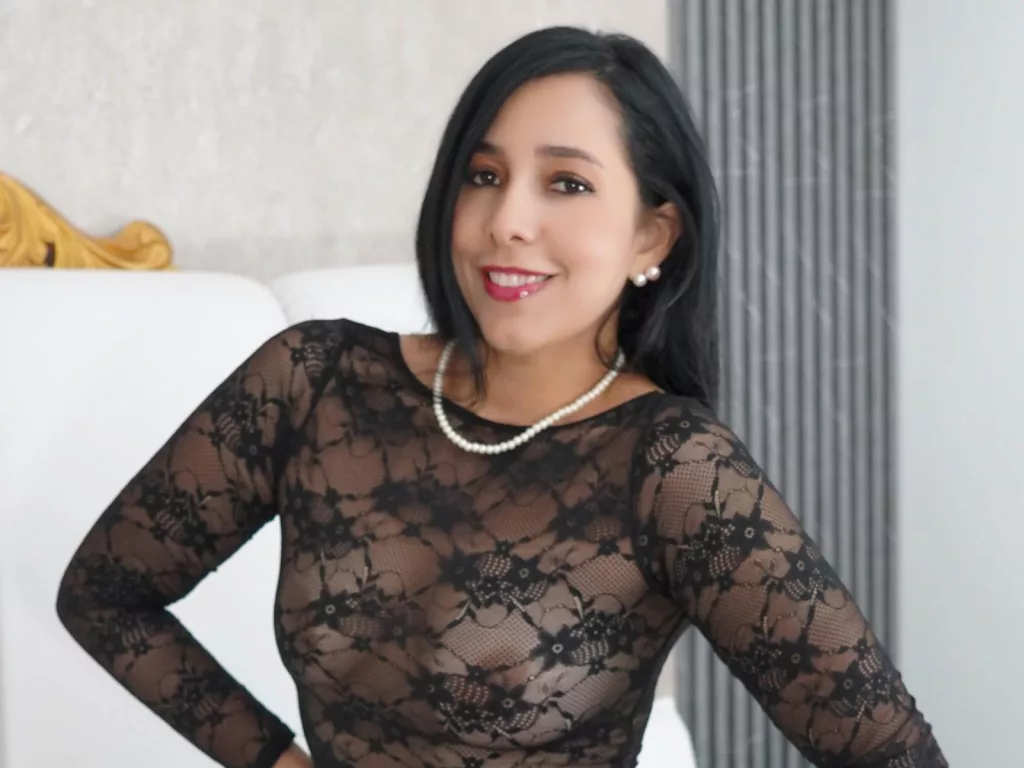 Katty’s nipples harden, exposed under delicate mesh lingerie.