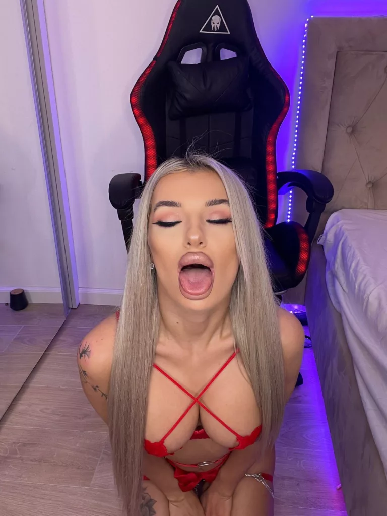 CelyneMay in red lingerie, tattoos, kneeling by gaming chair