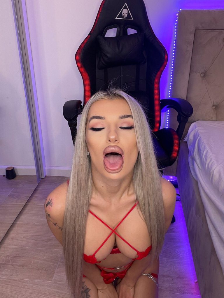 CelyneMay in red lingerie, tattoos, kneeling by gaming chair