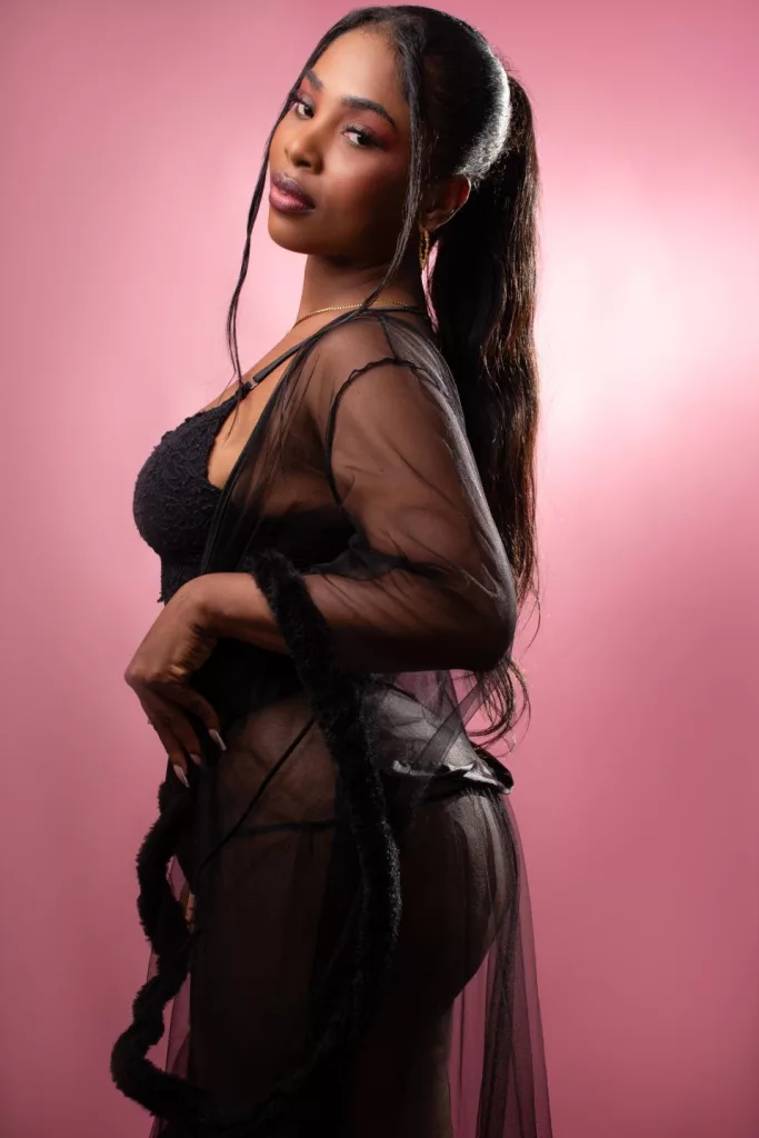 ZendayaRosse in braids, black sheer dress pose, ebony bbl
