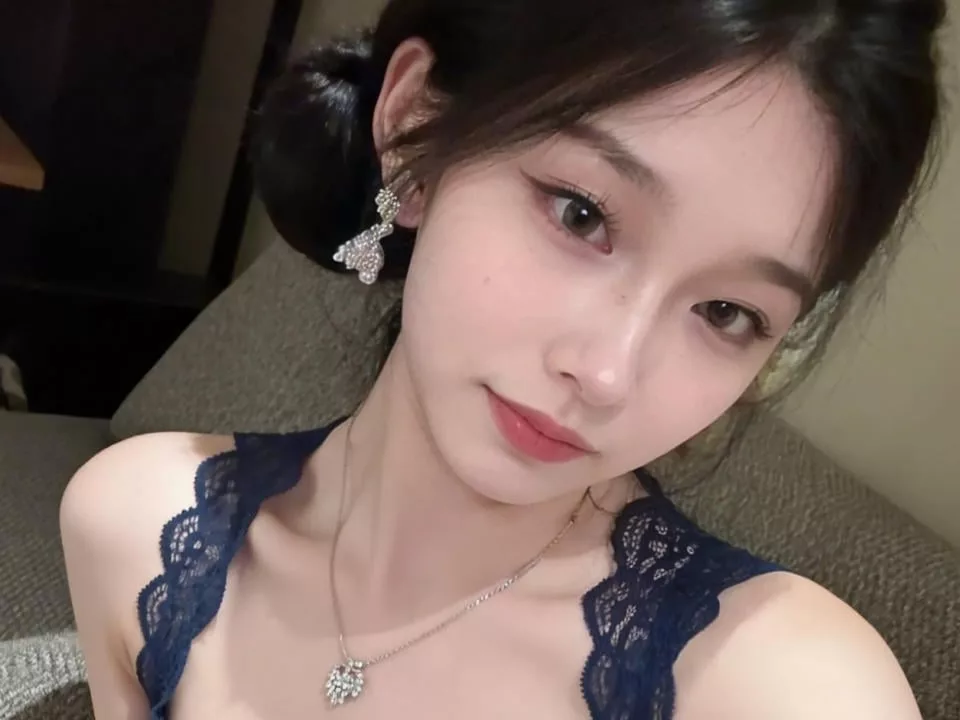 LinLinYa in black lace top, butterfly earrings—women and small penis love charm