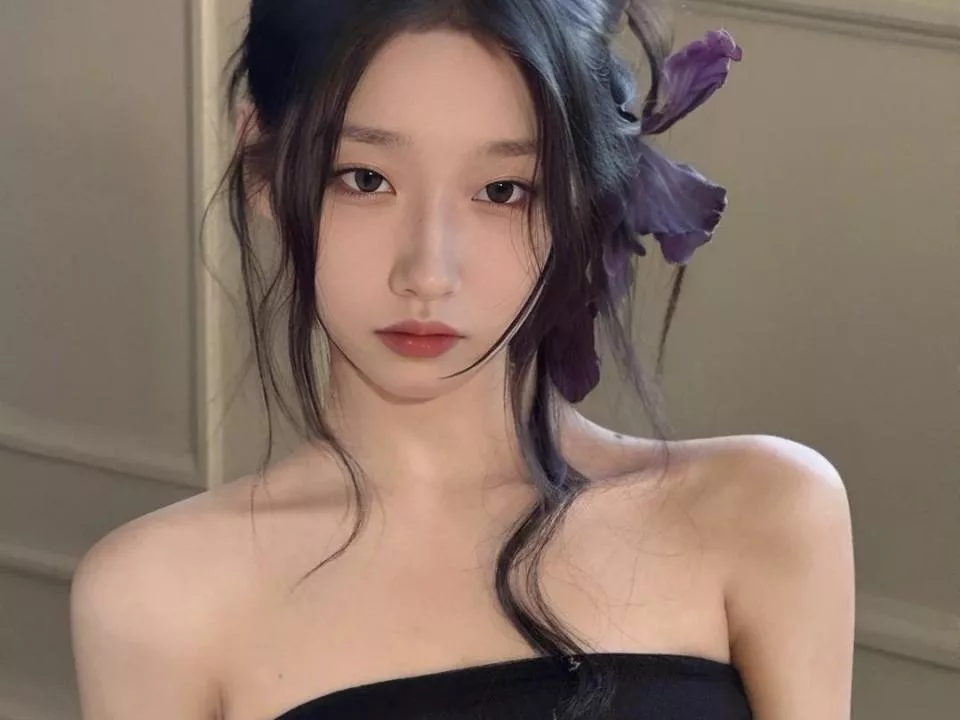 LinLinYa with purple flower, strapless top—elegant Asian beauty in soft light.
