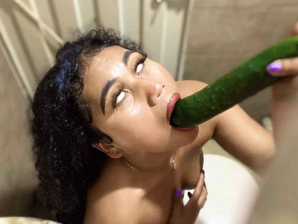 SophieSonyas role plays with cucumber, long big and green.