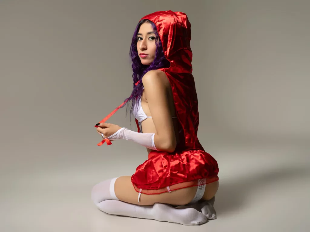 JuliaJobs in red lace skirt and capelet, kneeling with red ribbon