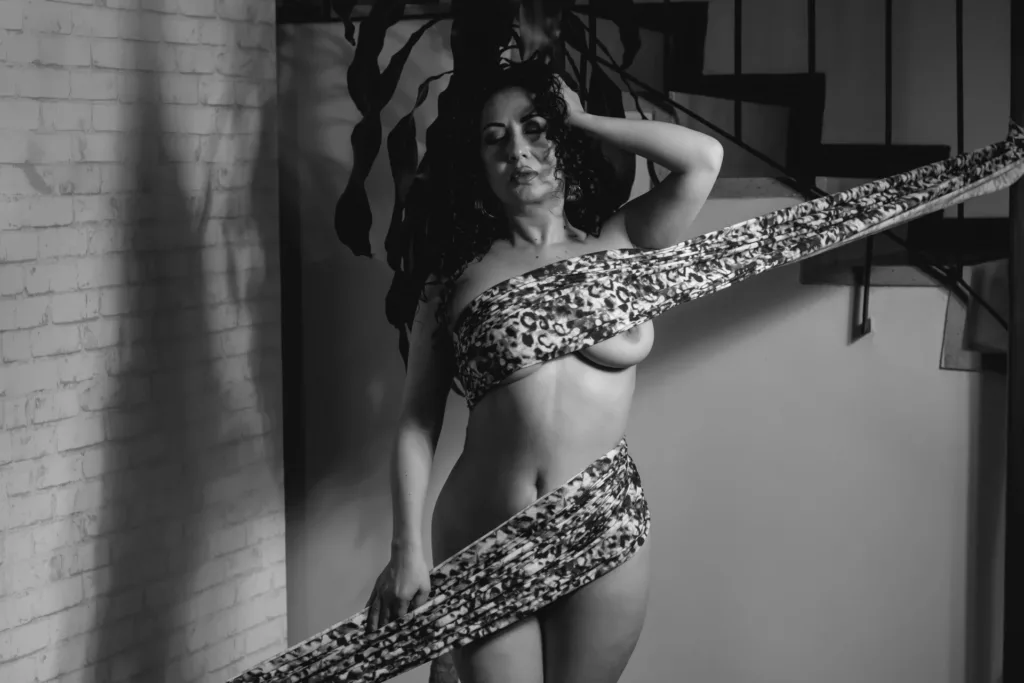 samanthaAntolin in leopard print, dramatic black-and-white, toned physique