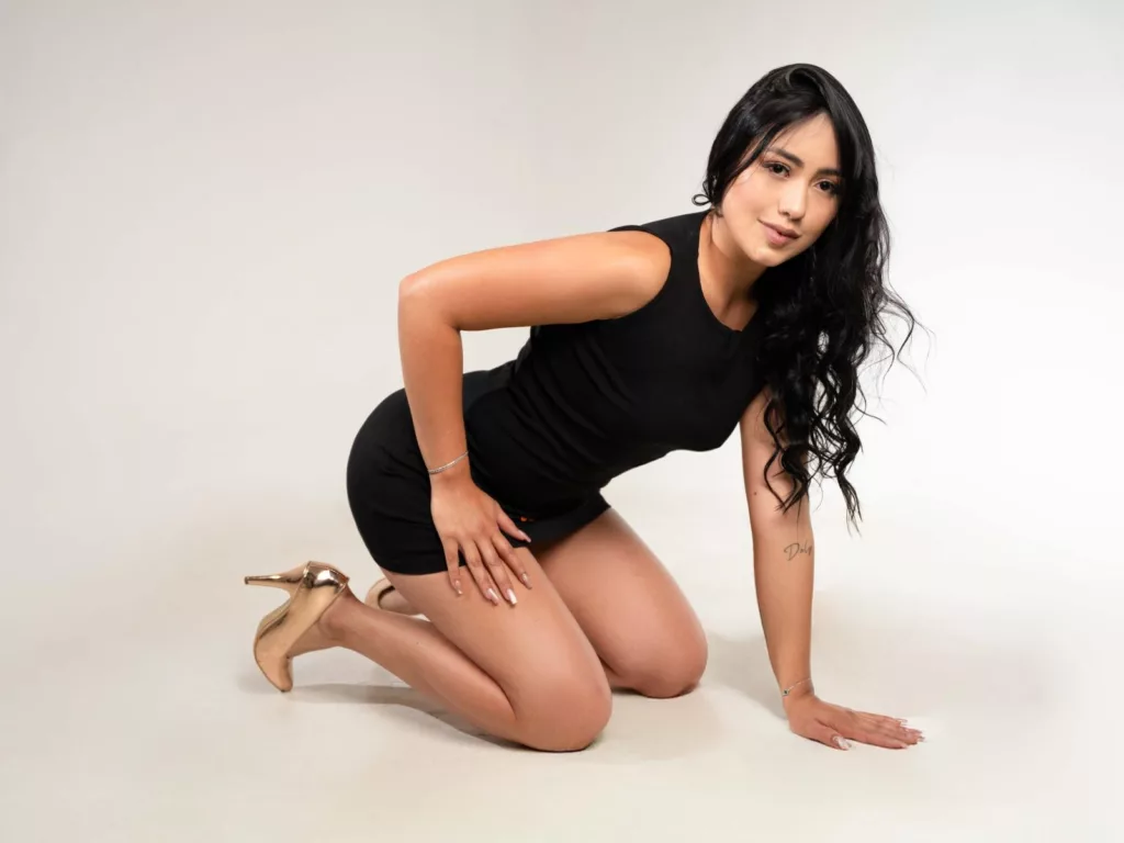 GiaaMoretti lounging in a black dress, an old men love favorite.