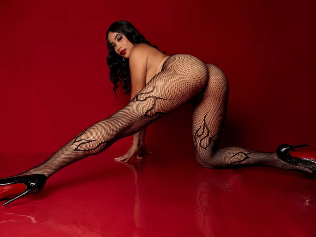 KarlaBella’s ebony nylon heel fetish on display in a bold red backdrop