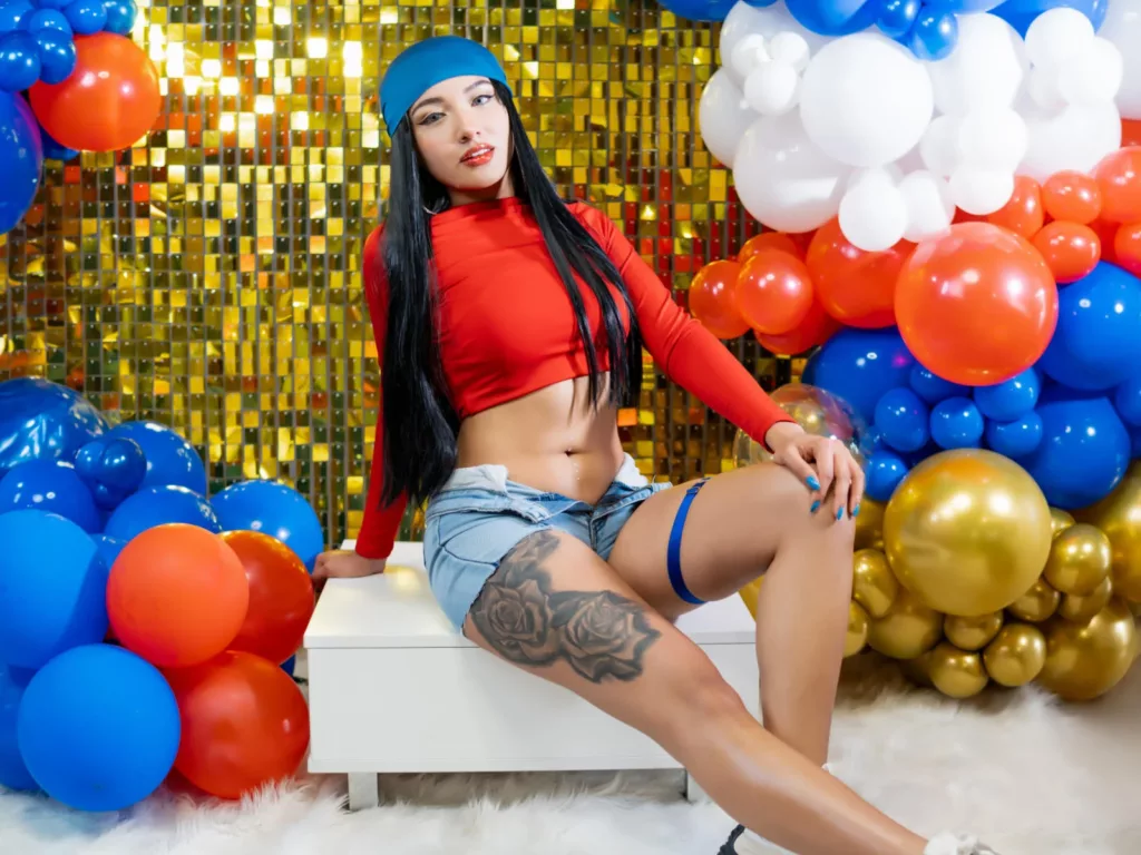 LillyTaylor blue beanie red top hairy bush colorful balloon wall